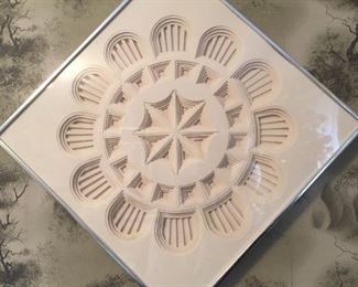 Framed molded pattern in frame.