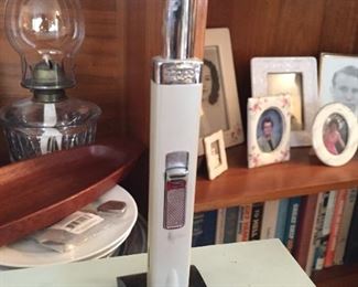 Vintage lighter on stand.