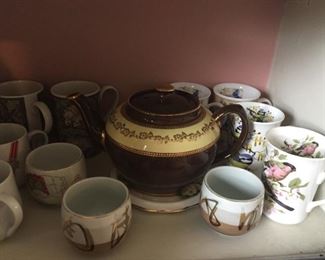 Mugs, teapot and tea cups.