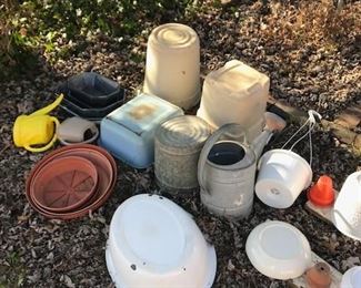Nice selection of planters and watering cans.