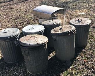 Galvanized metal trash cans.