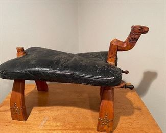 Carved camel, leather seat stool