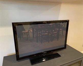 Samsung 42" TV, model # 42C-450BIDXZA
Ethan Allen gray media cabinet 