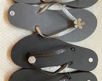 Many pairs of  NEW flip flops with & without jewels, in all sizes