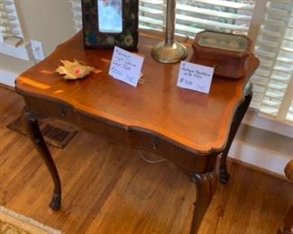 Single Drawer walnut hoof footed lamps table 28” tall 27 1/2” wide 21” deep.  $250