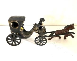 $75 - Amish cast iron horse drawn carriage and figure.  10" W, 2.5" D, 4" H.  