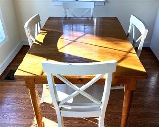 $350  Chuck Made in America signed Kitchen table with drawer.  Table: 54" L, 36" W, 30" H, plus 20" extension leaf. 