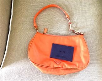 $225 Prada hand bag with authentication triangle logo.  9" W x 5.5" H (plus 7" from top of purse to middle of strap). 
