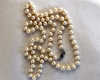 $20 Long individually knotted faux pearl necklace 