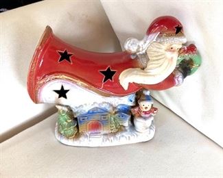 $25 Music Box ceramic Santa.  9.5" W, 3.5" D, 8" H. 