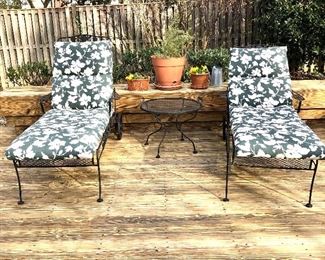 $295 - Pair of iron chaises with cushions.  Each 30" W, approx 72" L.   Side table: 25" diam, 19" H. 