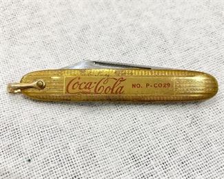 Coca Cola knife marked USA. Has clip on back. Loop for key chain. Not sure of the year made.
Good advertising for Coca Cola. Good blade and tip of knife. Gold finish on front with red lettering. $30
Some scratching.
Measures 2 3/4", blade measures 2".