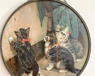 Antique round chromo lithograph chimney flue cover features adorable little kittens looking for the fly on the wall.
Chain is intact to hold the picture securely. Measures 9 1/2" round. Very good condition with no water stains. $50