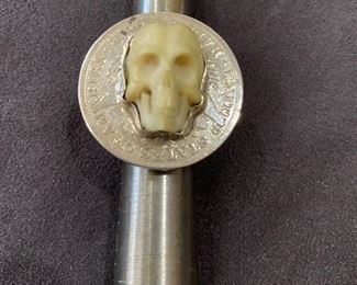 This ring was made by master silver smith. Skull is from a buffalo bone. Ring is sterling silver and base is from a "1907" half dollar.
Signed piece by Cherokee Silver. Size 6 1/2. Not sure of silver weight. $175