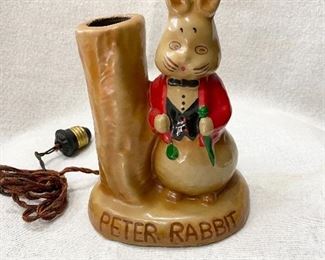 Darling old "Peter Rabbit" child's nursery lamp. Cord would need replaced. Very good condition with no chips or cracks.
Not sure of the material it's made from. Not ceramic or plaster. This lamp could be from the 1920's, 30's or 40's.
Measures 7 1/4" tall. 5 1/2" wide. Light weight probably less than a pound. $45