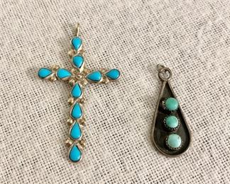 Sterling silver & turquoise cross (marked Sterling) measures 5" long and sterling & turquoise pendant. Both pieces $40