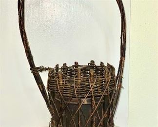 Old woven twig flower holder with metal insert. $20
