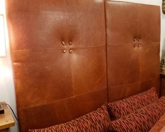 Kissabeth Furniture Co. leather upholstered king size headboard with polished geode buttons, wooden side and foot rails