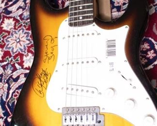 An Original Dickey Betts and Steven Seagal Autographed Electric Guitar.
