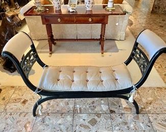 $595; Black and gold painted bench with tufted cream silk cushion and tassels; 33" H x 50" W x 15.5" D