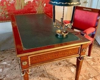 $2600; Louis XVI style ormolu writing table with leather top; 59’ L x 35” D x 30.5”H