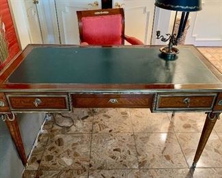 $2600; Louis XVI style ormolu writing table with leather top; three drawers; two keys;  59’ L x 35” D x 30.5”H