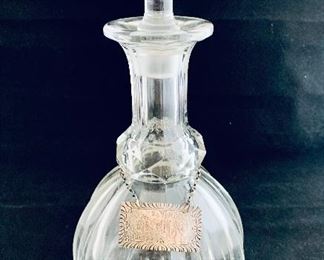 $90 - Crystal Decanter with Flared Stopper. Note: liquor tag is NOT INCLUDED; 10” H x 4.5" W