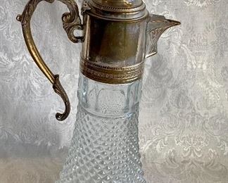 $60 - Pressed Glass Pitcher with Plated Handle and Internal Ice Reservoir; 14" H x 5.5" wide at base 
