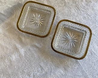 $60; Pair of Glass Coasters with Brass Rims; As is, one metal rim is unglued; each is 5.5" square 