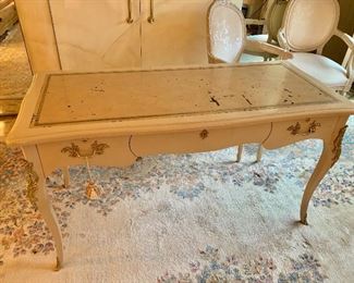 $225; Three Drawer Desk with Metal Accents; 30" H x 54" W x 24" D; As is: top is worn and scratched, lock has been removed from middle drawer.