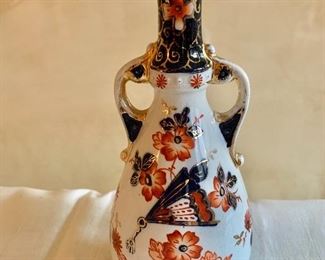 $60 - Imari vase with two handles; 8.5" H x 4" W; As is, small chip in the mouth  