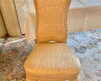 $120; French Provincial chair upholstered in cream quilted sateen; 44" H x 19" W, seat height is 19.5" H; as is