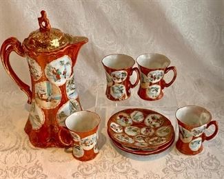 $95 - Coffee Pot and Demitasse Cups (4 cups, 3 saucers); coffee pot is 10" H  x 6" W