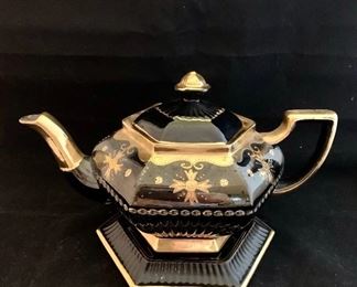 $85; Jackfield type pottery teapot on stand; 