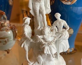 $195; Parian/bisque Figural group; as is, girl in front is missing a foot, man at top is missing instrument. 16" H x 9" W