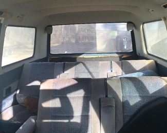 Turn that back row into a bed and put a roof rack on him, then hit the road!!!