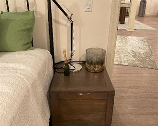 Crate and Barrel Tucker Grey Side Trunk,Grey-tinted mango wood transitions this trunk from pure storage to center stage as a small coffee or side table. Top pulls up with recessed handles to a roomy interior deep enough to store pillows and throws as well as books, DVDs or games. Removable tray is an extra plus for spur-of-the-moment refreshments.Width: 21",
Depth: 22.5",Height: 21"