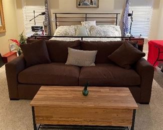 Crate and Barrel Axis Sofas and another in sofa sleeper in Warm Dansen Mocha micro fiber, coffee table that lifts for storage and storage on rack underneath