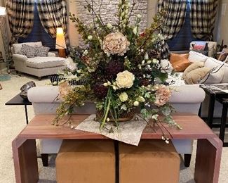 Console Table with Many floral arrangement all throughout the home