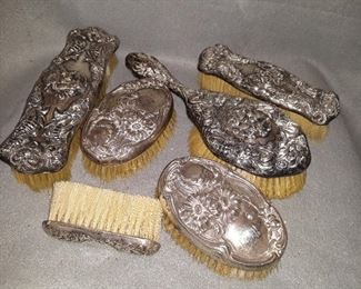  Grouping of Sterling Repousse Vanity Brushes