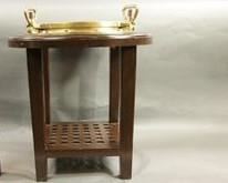 A Mahogany and Brass Table Stand in the Form of a Ship's Porthole.