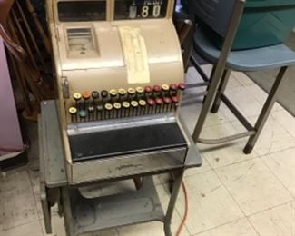 Old cash register with metal stand