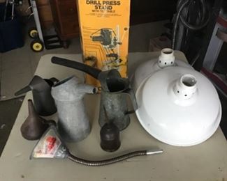Vintage Oil Items, couple of enamel industrial lamp shades and in the background a drill press stand in it’s original box.