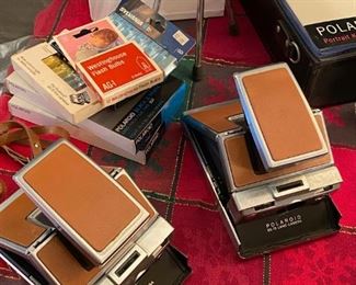 Vintage Polaroid SX-70 Land Cameras in great condition. Sealed film and flash bars also available