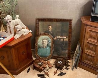 Old framed portraits, cuckoo clocks, Wien Austria poodles. dining area