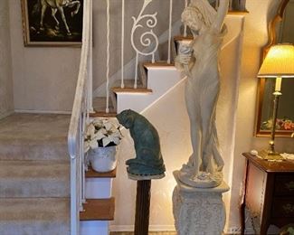 Beautiful vintage female statue on pedestal base marked Danza Del Flori after Giorgio Ceragioli.  Vintage cast siamese cat. Located in foyer.
