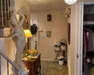 Right of front entrance leads to basement, garage, and kitchen. Can also enter kitchen through dining room