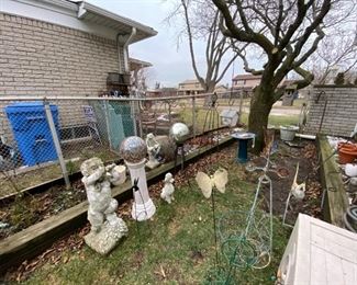 Vintage garden art located outside,  enter through side door of garage