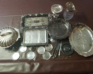 https://ctbids.com/#!/description/share/697657 Silver plated pitcher, soup warmer, plug in shell warmer, coasters, knives and plate hangers.

