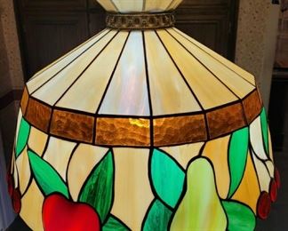 https://ctbids.com/#!/description/share/697691 This is a 70's Tiffany style stained glass fruit lamp. It’s  18" across and 13" tall and has a long chain to adjust to the desired height of your room.

